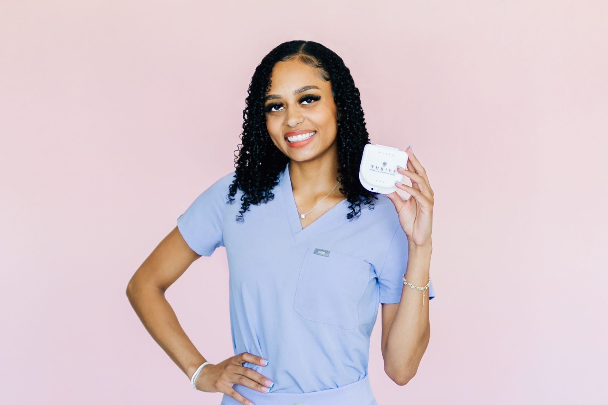 Patient with braces at Thrive Dental and Orthodontics on Forest Lane